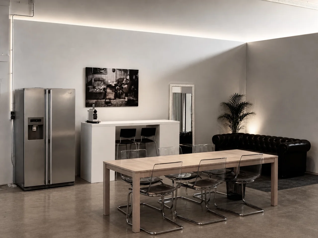 Relax room to unwind, bar stools, mirror, artwork, and seating furniture